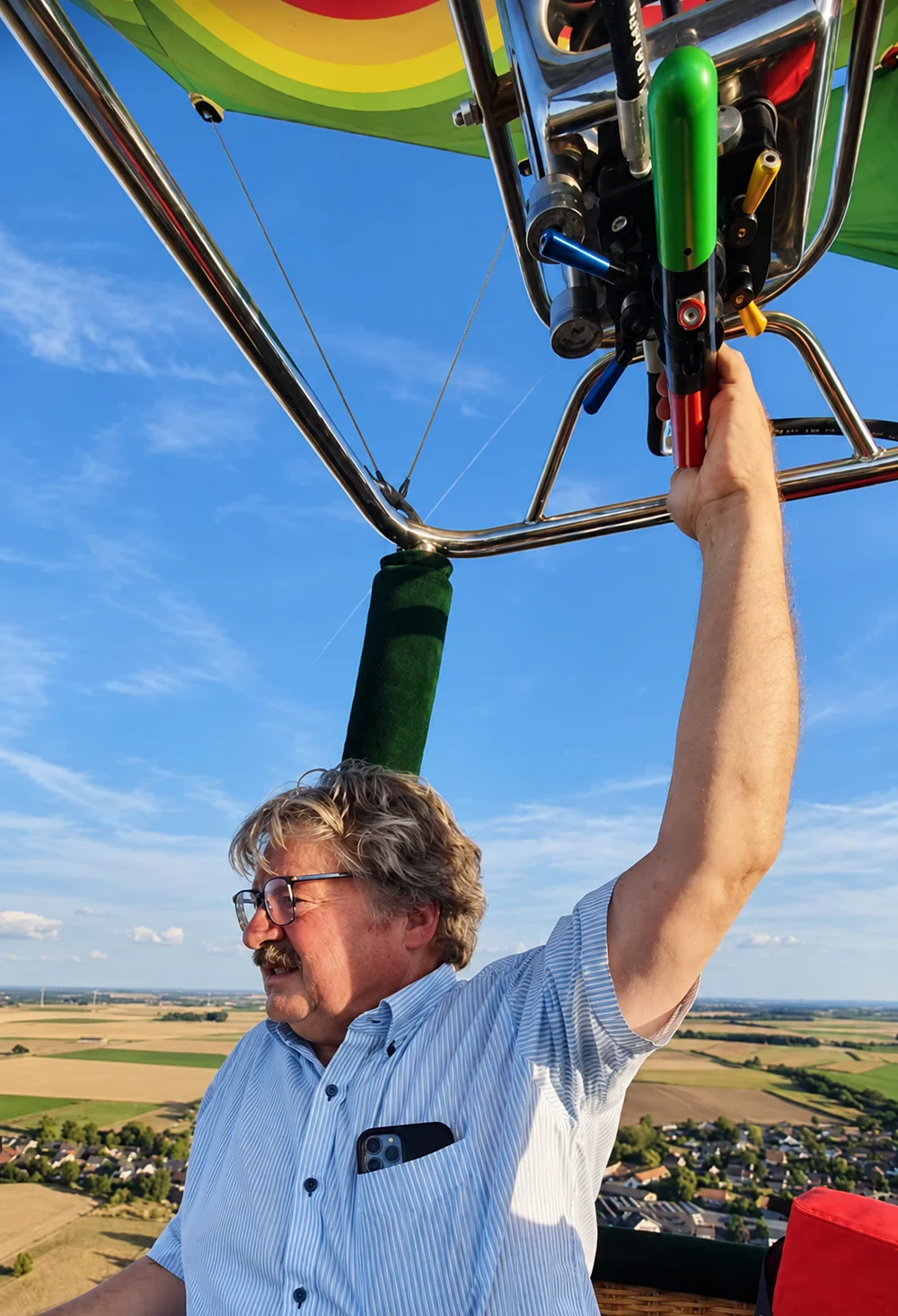 Charles Desmet at the controls of a hot air balloon